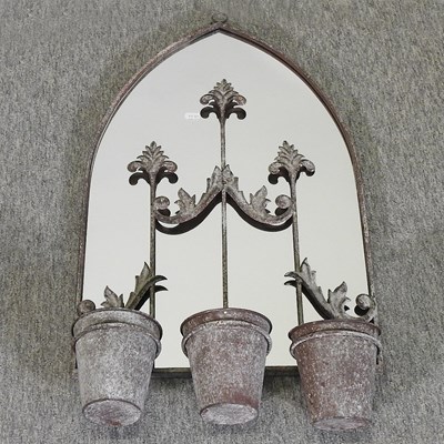 Lot 430 - A metal framed garden mirror