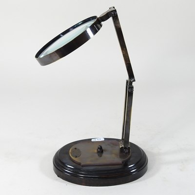 Lot 201 - A table magnifier on stand