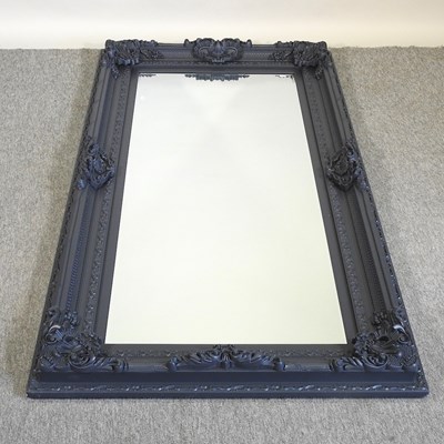 Lot 566 - A large wall mirror