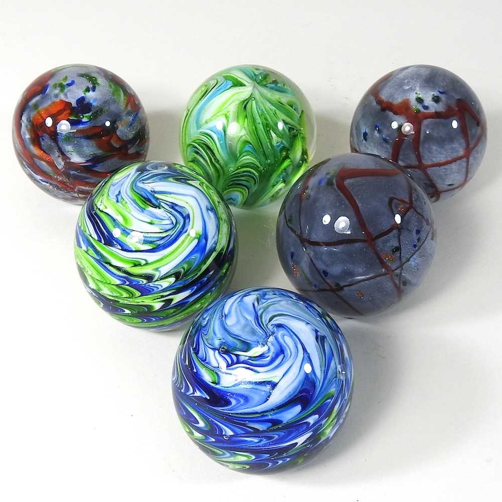 Lot 117 A set of six coloured glass paperweights