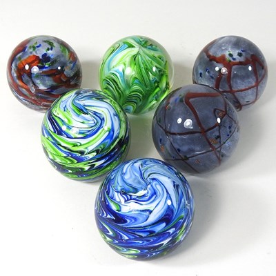 Lot 117 - A set of six coloured glass paperweights