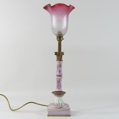 Lot 211 - A 19th century French pink pottery lamp