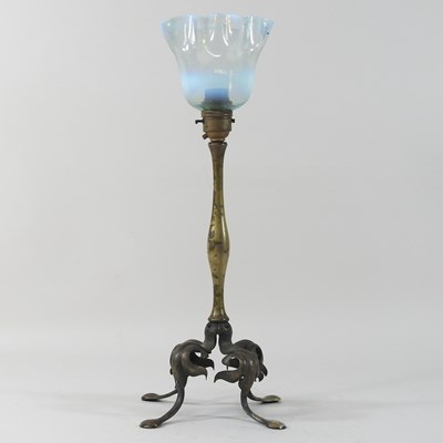 Lot 235 - An early 20th century brass Arts and Crafts lamp and shade