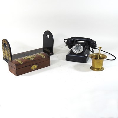 Lot 5 - A vintage black bakelite telephone