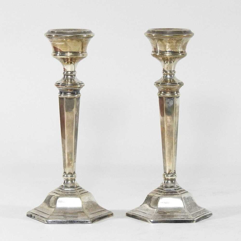 Lot 22 - A pair of silver table candlesticks