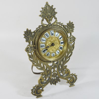 Lot 239 - An ornate 19th century brass cased strutt clock