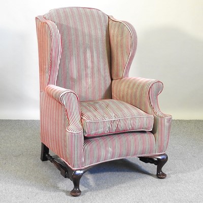 Lot 609 - A Queen Anne style wingback armchair