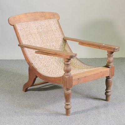 Lot 574 - A teak plantation chair