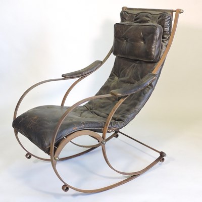 Lot 334 - A 19th century iron rocking chair