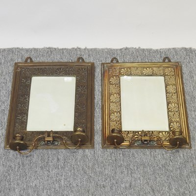 Lot 258 - A pair of Arts and Crafts brass framed wall mirrors