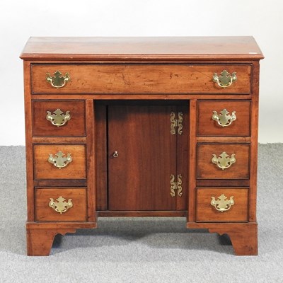 Lot 294 - A George III style desk