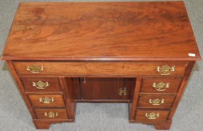 Lot 294 - A George III style desk