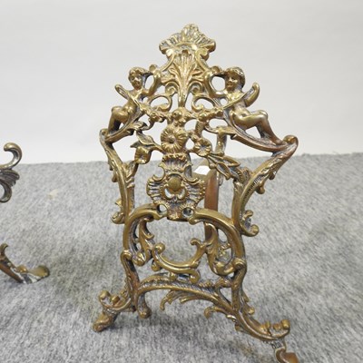 Lot 72 - A pair of ornate 19th century brass fire dogs