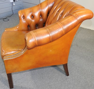 Lot 118 - A leather armchair