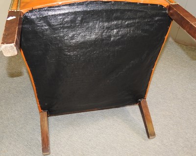 Lot 118 - A leather armchair