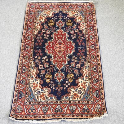 Lot 744 - A Persian woollen rug