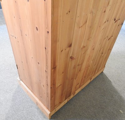 Lot 574 - A modern pine double wardrobe