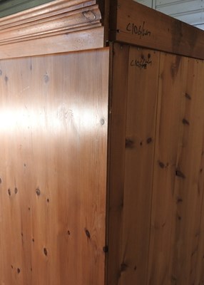 Lot 574 - A modern pine double wardrobe