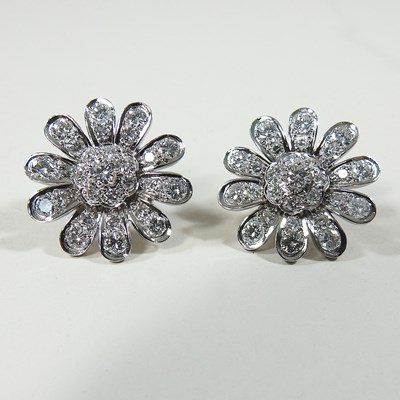 Lot 106 - A pair of diamond earrings