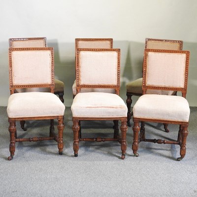 Lot 816 - A set of six oak dining chairs