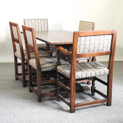 Lot 485 - An oak dining suite