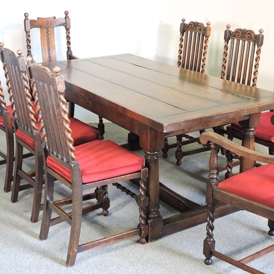 Lot 501 - An oak dining room suite