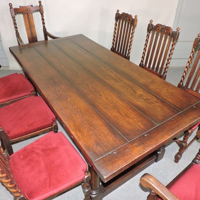 Lot 501 - An oak dining room suite