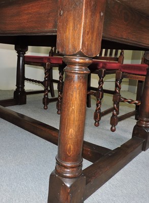 Lot 501 - An oak dining room suite