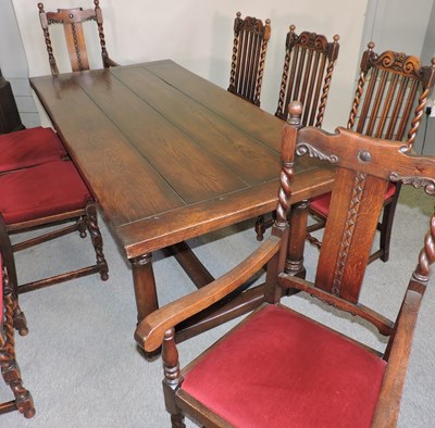 Lot 501 - An oak dining room suite