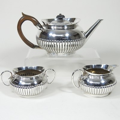 Lot 365 - A silver three piece tea service