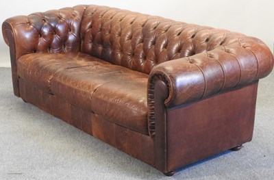 Lot 352 - A modern brown leather upholstered button back chesterfield sofa