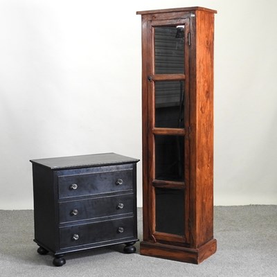 Lot 839 - A hardwood glazed narrow cabinet