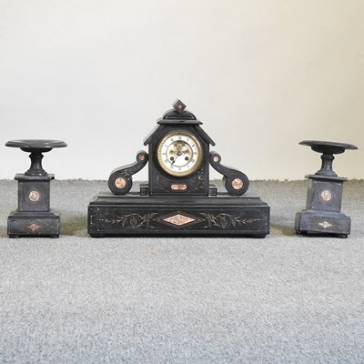 Lot 687 - A Victorian black slate clock garniture