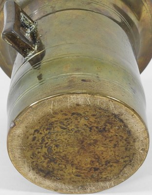 Lot 164 - A bronze pestle and mortar