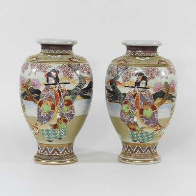 Lot 702 - A pair of Satsuma vases