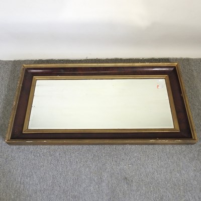 Lot 711 - A gilt and mahogany framed mirror