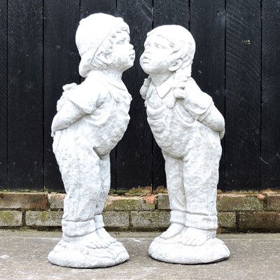 Lot 512 - A pair of cast stone figures