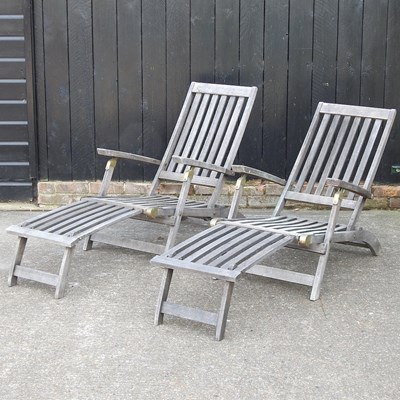 Lot 464 - A pair of teak steamer chairs