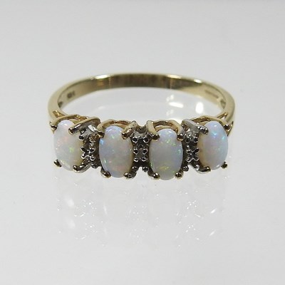 Lot 397 - A 9 carat gold opal ring