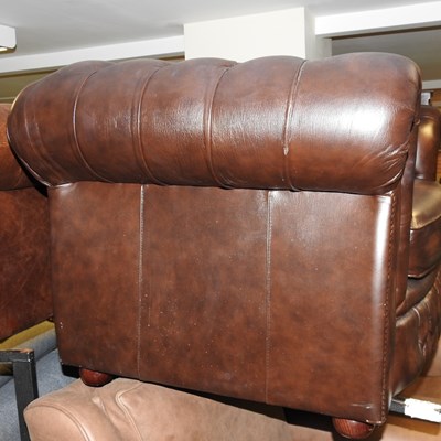 Lot 306 - A brown leather upholstered chesterfield sofa