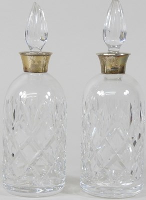 Lot 72 - A pair of silver and cut glass decanters