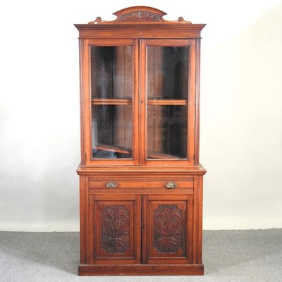 Lot 394 - A late Victorian walnut cabinet bookcase