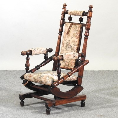 Lot 587 - A children's American rocking chair