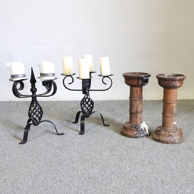 Lot 428 - A pair of iron candelabra