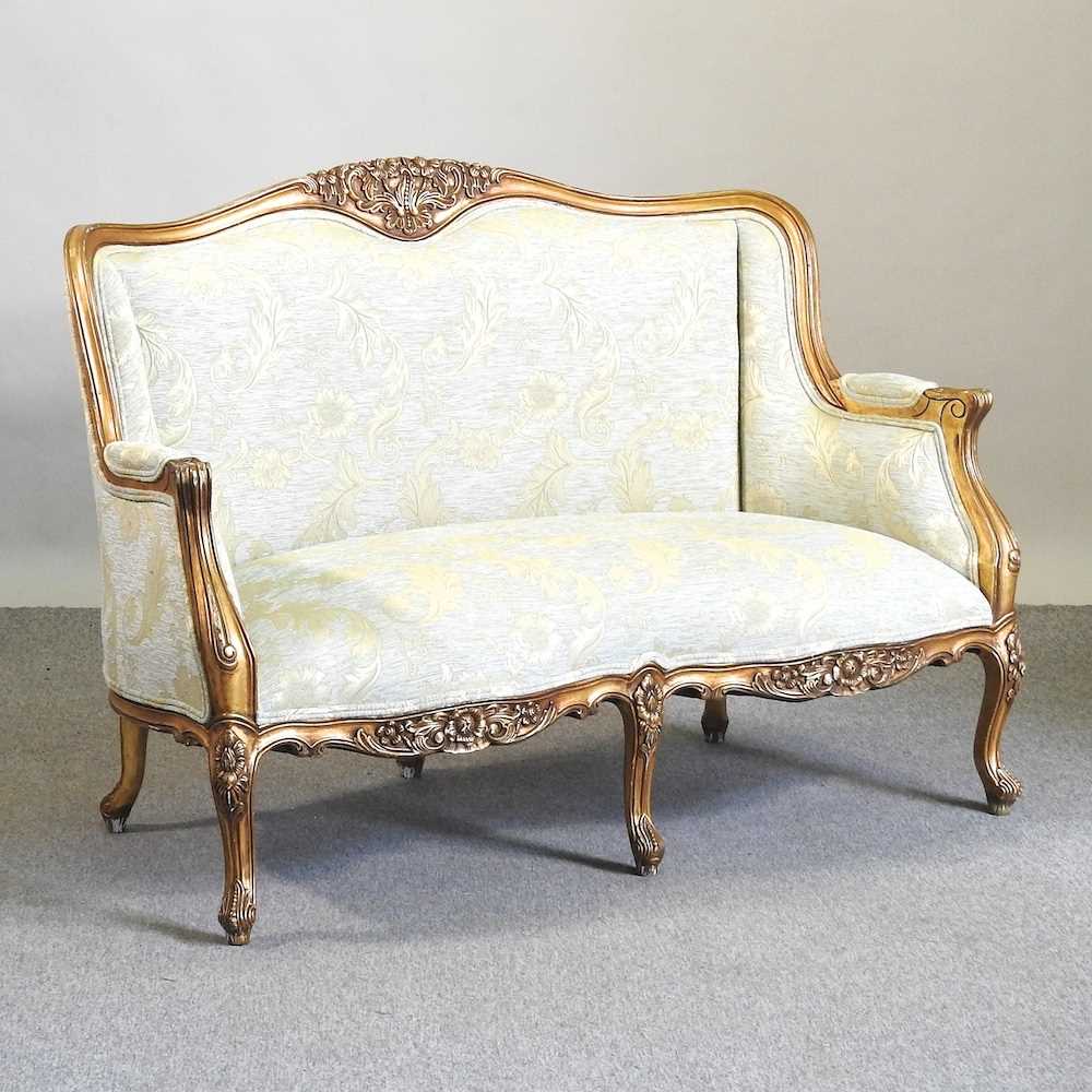 Lot 574 - A gilt framed sofa