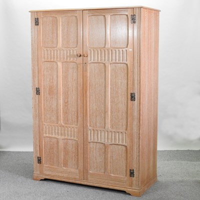 Lot 97 - A mid 20th century limed oak double wardrobe