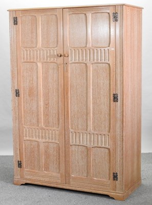 Lot 97 - A mid 20th century limed oak double wardrobe