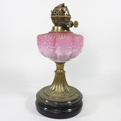 Lot 251 - A 19th century pink glass oil lamp