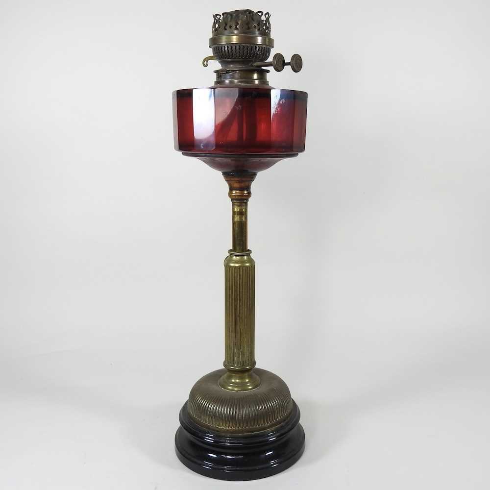 Lot 201 A brass oil lamp