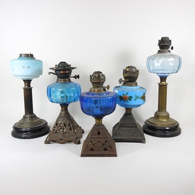 Lot 237 - A collection of five oil lamp bases